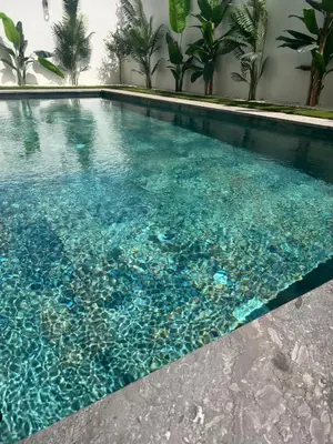a swimming pool filled with clear blue water at Apartement avec piscine privée Casablanca in Casablanca