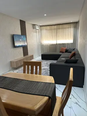 a living room with a couch and a table at Calm studio in Casablanca