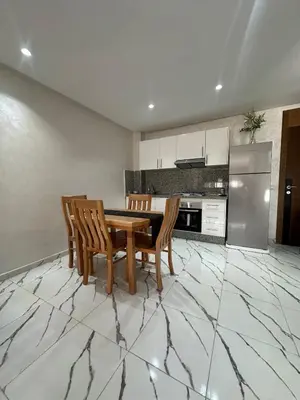 a kitchen with a dining room table and chairs at Calm studio in Casablanca