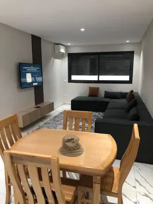 a living room with a table and a couch at Calm studio in Casablanca
