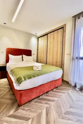 a bedroom with a large bed in a room at Logement cosy avec terrasse in Casablanca