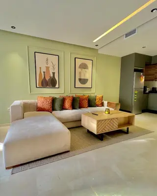 a living room with a couch and a coffee table at Logement cosy avec terrasse in Casablanca
