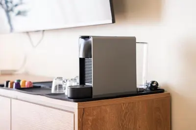 a coffee maker sitting on top of a counter at Résidence Dunkerque - Duplex in Casablanca