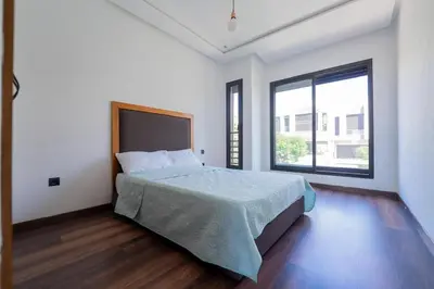 a bedroom with a bed and a large window at Villa vue océan Jack Beach Bay in Tamaris