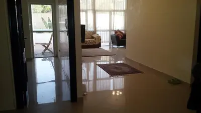 a view of a living room with the door open at apparttement confort residence marina beach a mohammedia in Mohammedia