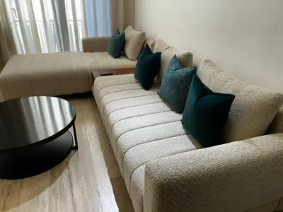 a living room with a couch and a table at Prestige Aman in Casablanca