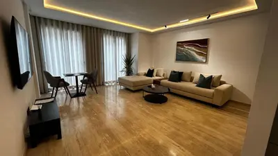 a living room with a couch and a table at Prestige Aman in Casablanca