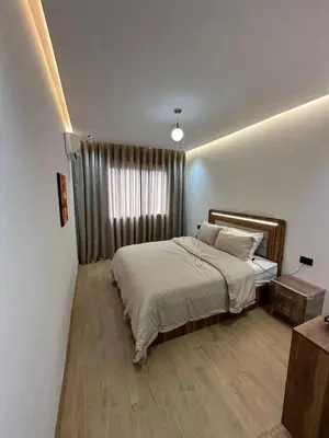 a bedroom with a large bed and a window at New Living House in Casablanca