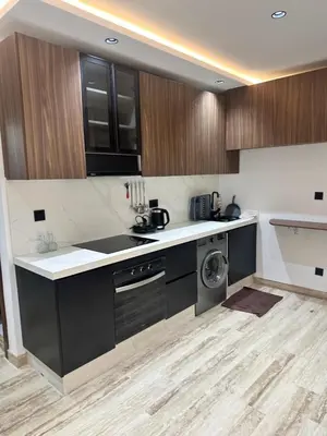 a kitchen with a sink and a dishwasher at New Living House in Casablanca