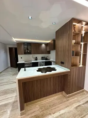 a kitchen with a large island in the middle at New Living House in Casablanca