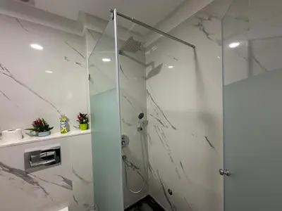 a shower with a glass door in a bathroom at New Living House in Casablanca