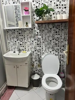 a bathroom with a toilet and a sink at Super apartment Near Hassan II Mosk and Corniche in Casablanca