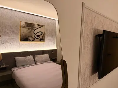 a bedroom with a bed and a mirror at Sweet Stay in Casablanca