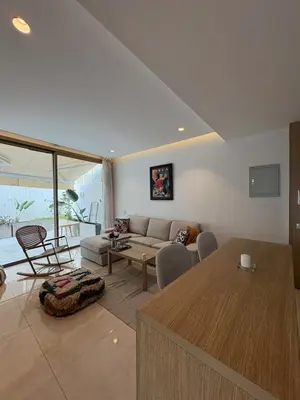 a living room with a couch and a table at Chic One Bedromm Apartment - Large Terrace - Anfa District in Casablanca
