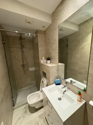 a bathroom with a sink and a toilet and a shower at Chic One Bedromm Apartment - Large Terrace - Anfa District in Casablanca