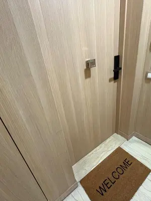 a wooden door with a welcome mat in front of it at Chic One Bedromm Apartment - Large Terrace - Anfa District in Casablanca