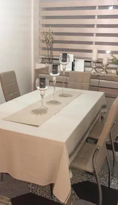 a table with two wine glasses on top of it at Apartment at Melissa's, sea view, Res Assabah in Rabat