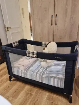 a black bunk bed with a stuffed animal on it at Blue paradise in Rabat