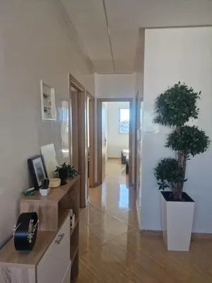 a hallway with potted plants in a room at APPARTEMENT DE LUXE 3 Façades in O Ben Slimane