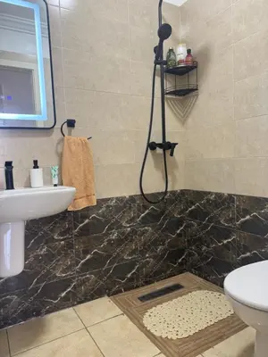 a bathroom with a sink and a toilet and a shower at Blue Ocean Escape Sidi Rhal in Sidi Rahal