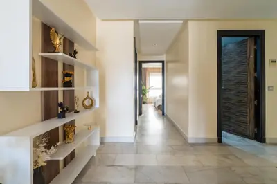 a hallway with a door and a tile floor at Yacht appartement Waterfront Complex 2 Bedrooms 2 Bathrooms in Casablanca
