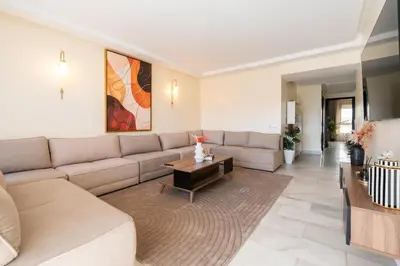 a living room with a couch and a coffee table at Yacht appartement Waterfront Complex 2 Bedrooms 2 Bathrooms in Casablanca