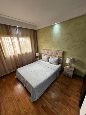 a bedroom with a large bed and a window at Morocco House in Casablanca