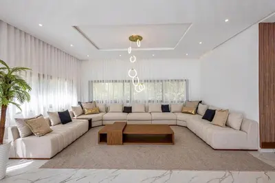 a living room with a couch and a coffee table at Villa Indigo in Rabat