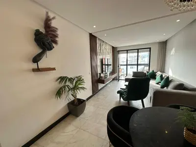 a living room with a couch and a table at Luxury Modern Apartment in the Heart of the City with Balcony Overlooking Twin Towers in Casablanca