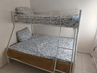 a room with two bunk beds in a room at Baraka house in Sidi Yahia az Zaʼer