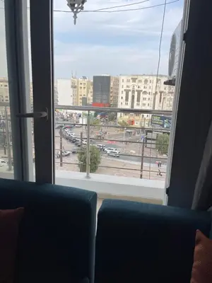 a view of a city street from a window at Furnished apartment in the middle of the city in Casablanca