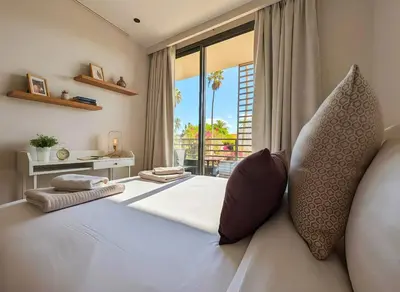 a bedroom with a bed with a large window at Maya Suites - Opale Sea Side in Anfa-Supérieur