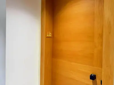 a wooden door with the number on it at Maya Suites - Opale Sea Side in Anfa-Supérieur