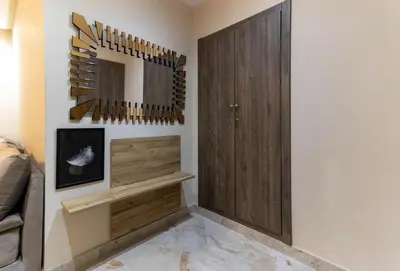 a room with a mirror on the wall and a closet at Appartement élégant a Parc Mohammedia - proche de la mer in Mohammedia