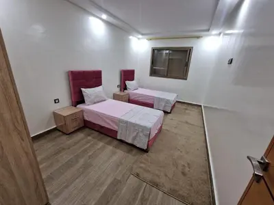 a room with two beds and a window at فيكتوريا in Casablanca