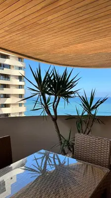 a dining room table with a view of the ocean at The Pearl - 3 Chambres Marina - By AppartAli in Casablanca