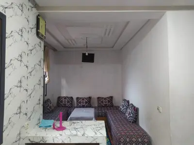 a living room with a couch and a table at New Luxury Apart Victoria- Casablanca 2BR
