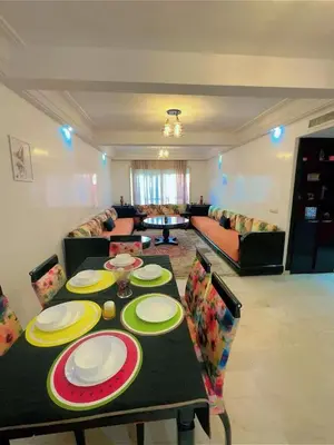 a living room with a table and a couch at Paradise Casablanca in Casablanca