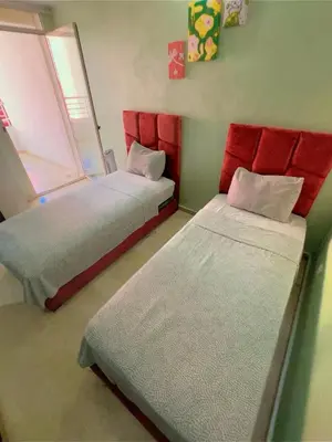 a room with two beds and a window at Paradise Casablanca in Casablanca