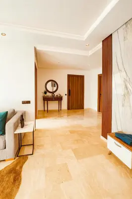 a living room with a couch and a table at Jolie appartement bord de mer de standing in Mohammedia