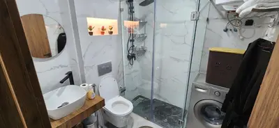 a bathroom with a shower and a toilet and a sink at Le Casablanca in Maarif