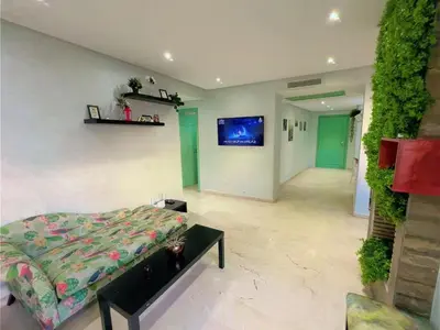 a bedroom with a bed and a tv on the wall at Casa Stay in Casablanca