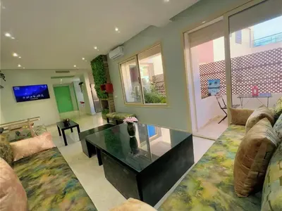 a large living room with a glass coffee table at Casa Stay in Casablanca