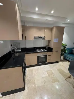 a kitchen with a sink and a stove top oven at Studio de lux in Casablanca