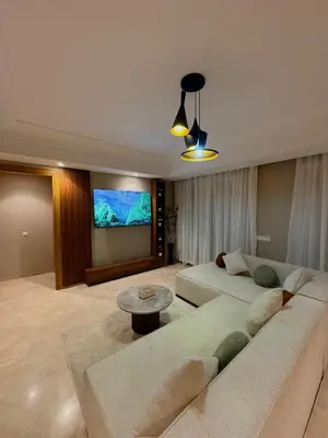 a living room with a couch and a tv at Smile City Homes in Casablanca