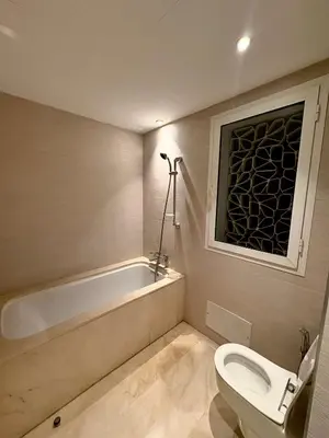 a bathroom with a toilet and a bath tub at Smile City Homes in Casablanca