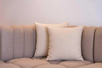 two pillows sitting on top of a couch at Cozy Studio with Pool & Parking in Aïn Harrouda