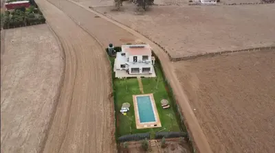 an aerial view of a house in a field at Ferme royale Bensliman in O Ben Slimane