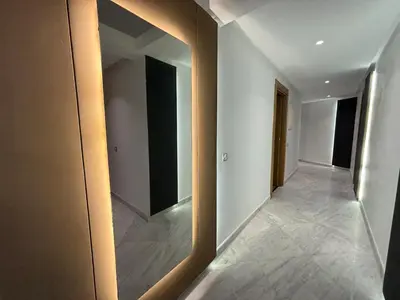 an empty hallway with a mirror in a building at Corniche Casablanca - Kimberly Luxury Suite in Casablanca