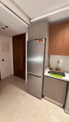 a kitchen with a stainless steel refrigerator and a sink at Castilo in Casablanca